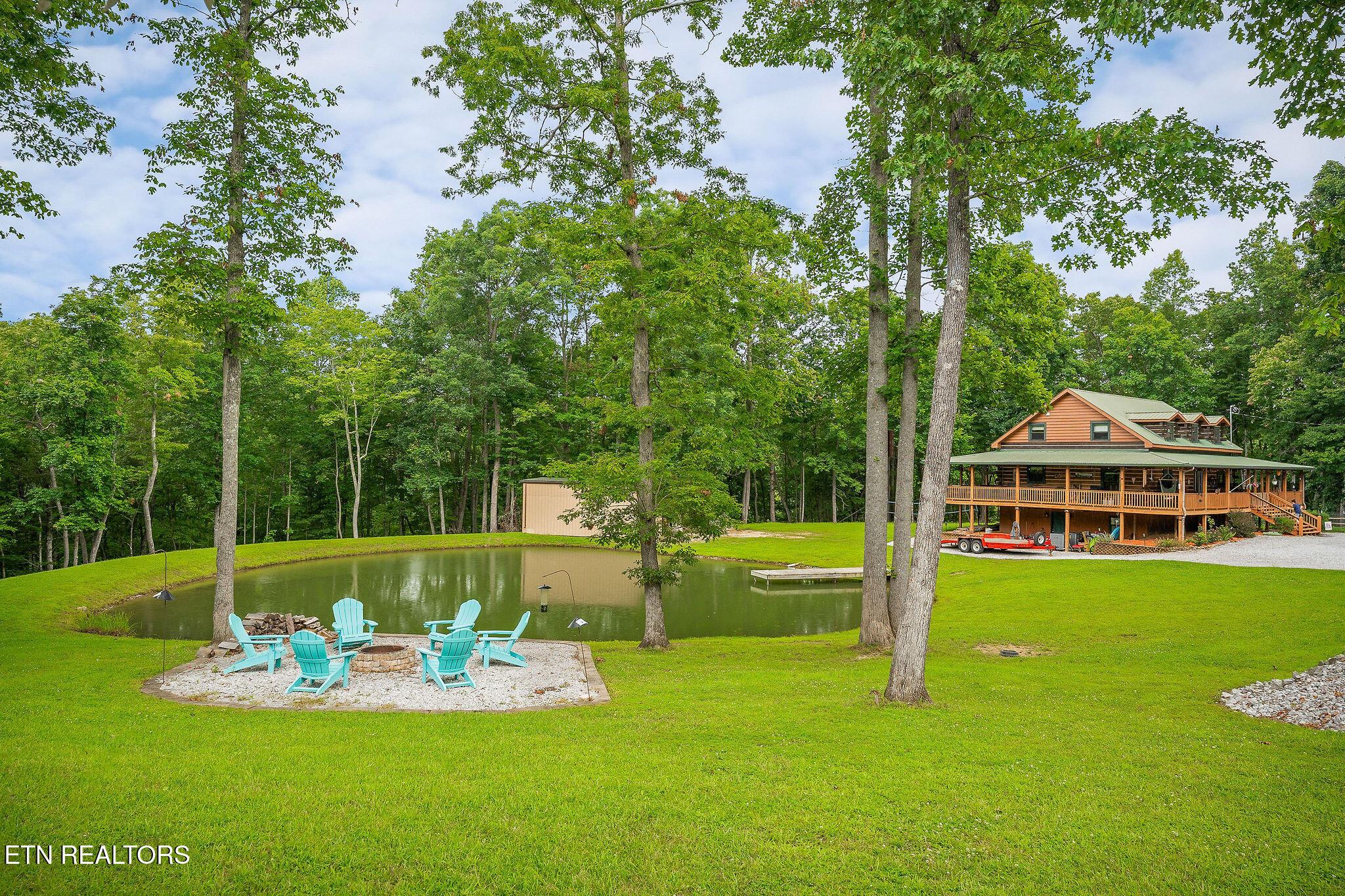 Image 1: LOG HOME WITH POND 1