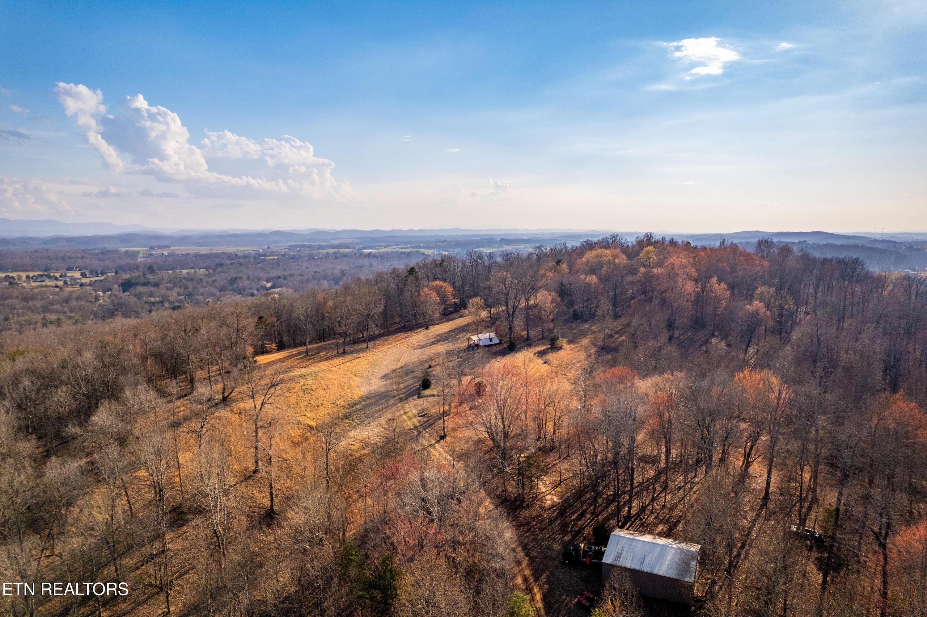 Image 3: Drone of barn and cabin