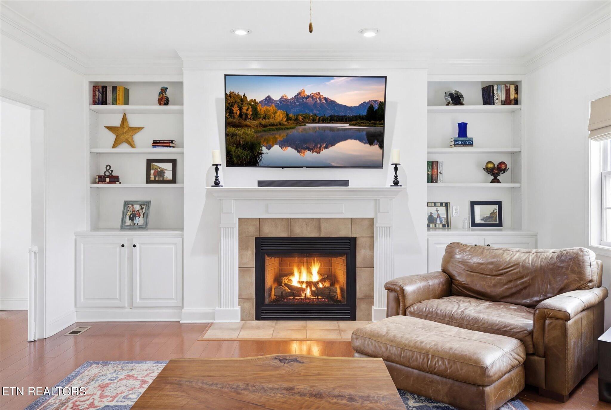 Image 4: Fireplace Flanked with Built Ins
