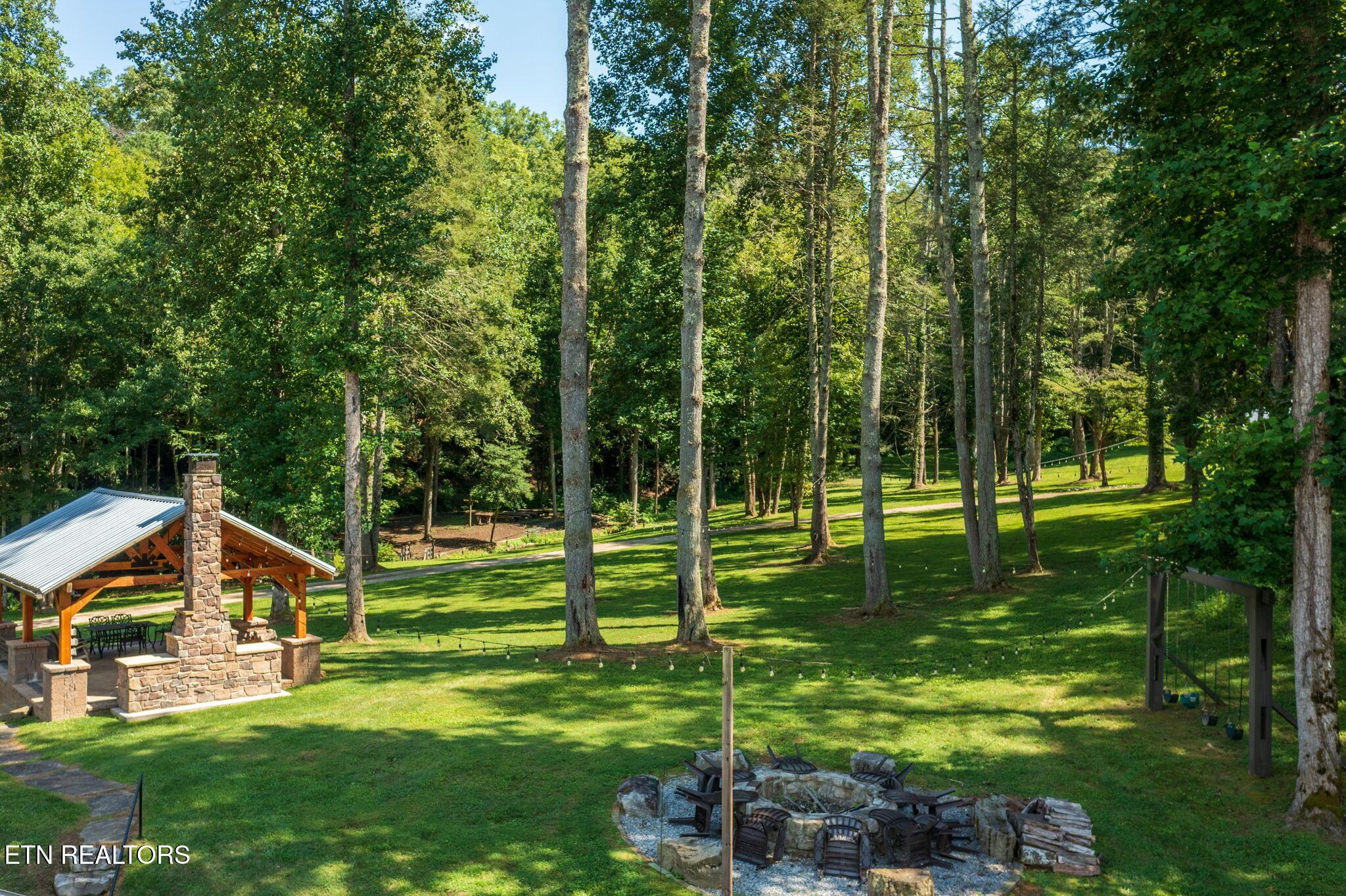 Image 3: Firepit, Pavilions, Swing Set & Chapel