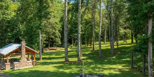 Image 3: Firepit, Pavilions, Swing Set & Chapel