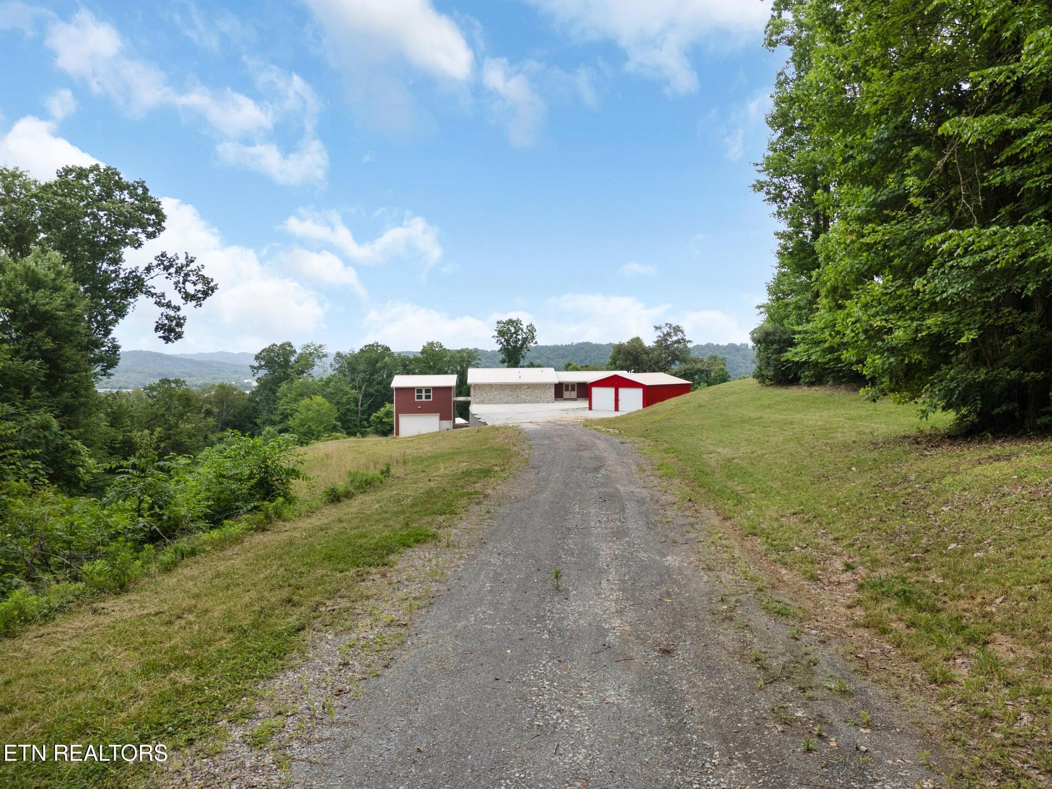 Image 2: Long driveway with view