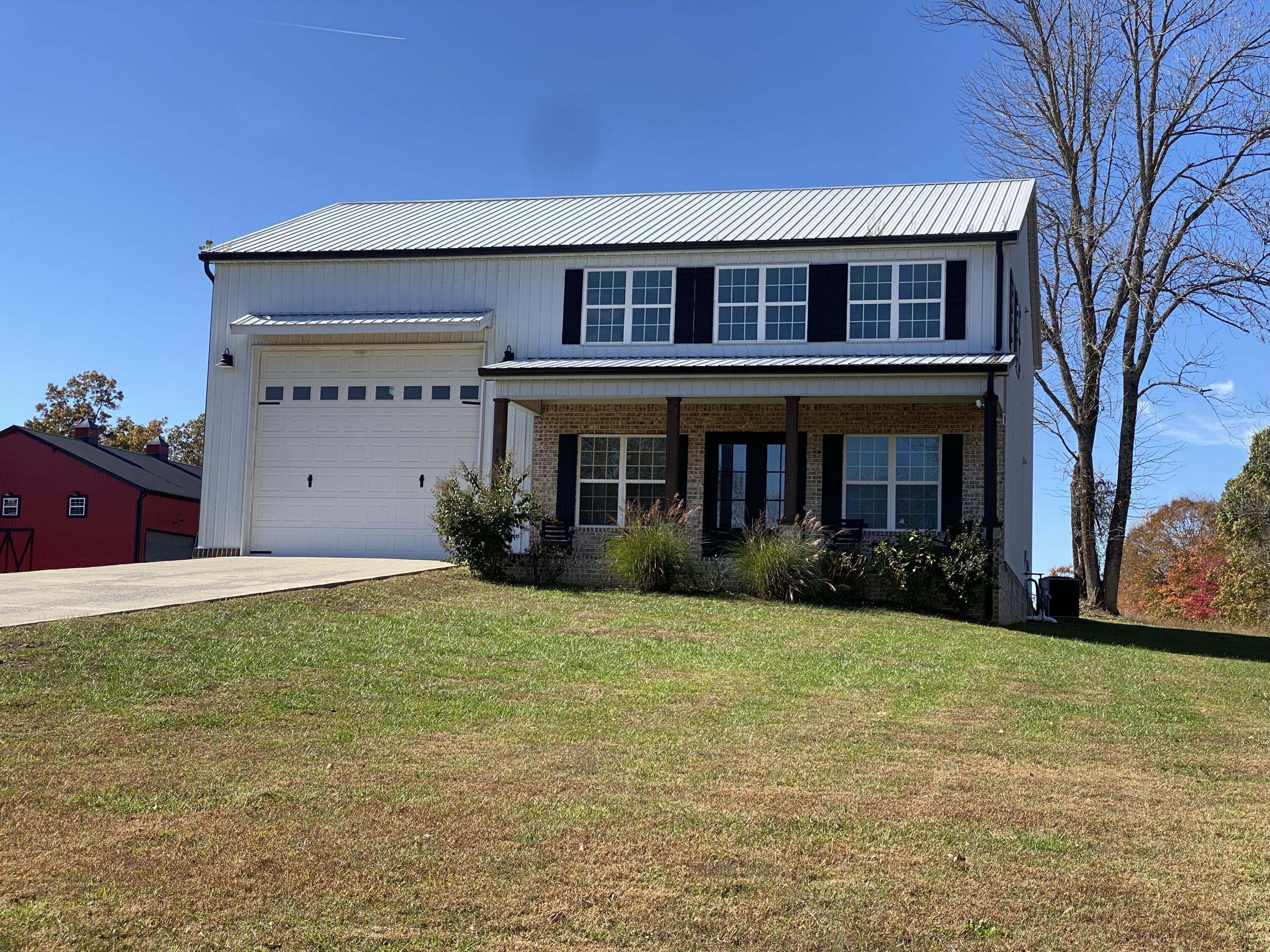 Image 1: White barndominium 3