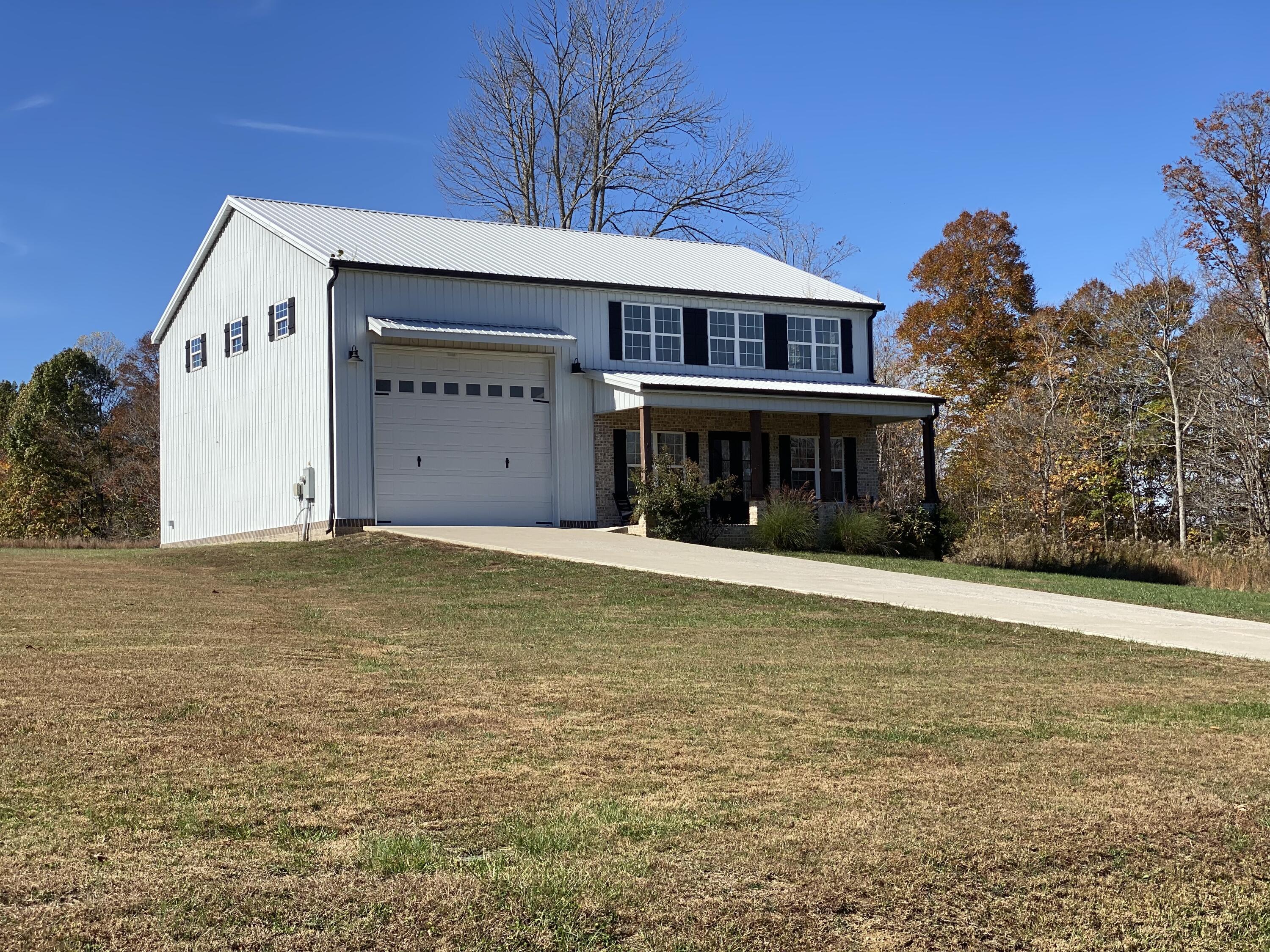 Image 2: White barndominium 1