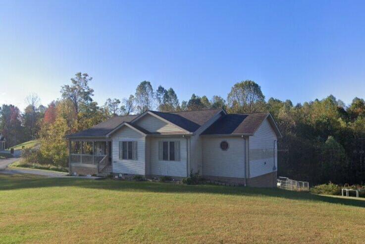 Image 2: Front Exterior with lot