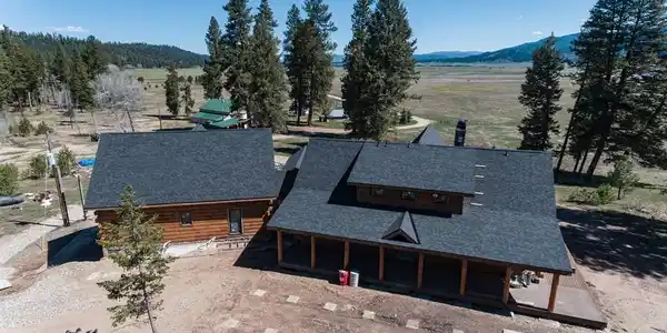 Image 2: Unfinished log cabin (7171 SF)