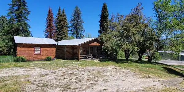 Image 3: Log cabin and shed included