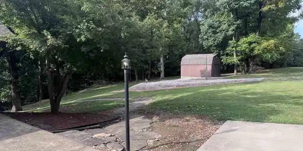 Image 1: RV hook up available between house and storage building