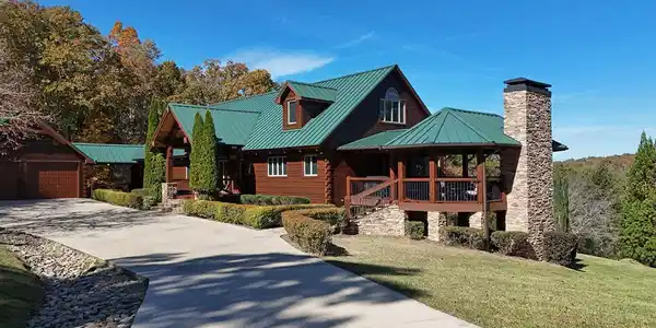 Image 2: Side view, Daisy Log Lodge, Gazebo with outdoor Fireplace, TV, Ceiling Fans