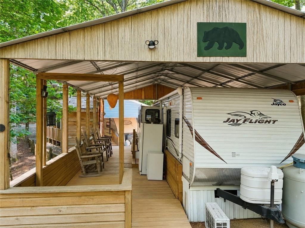 Image 3: Front of Structure, This 2012 Jaybird sits underneath an amazing metal canopy to help ensure protection from hail or other acts of nature!