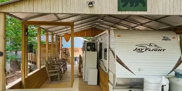 Image 3: Front of Structure, This 2012 Jaybird sits underneath an amazing metal canopy to help ensure protection from hail or other acts of nature!