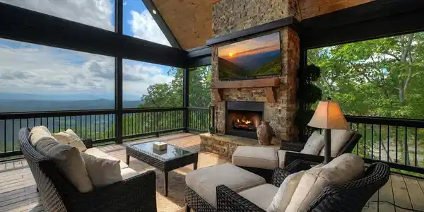 Image 4: Main level oversized back covered deck, Rock fireplace and screened in with year round views!