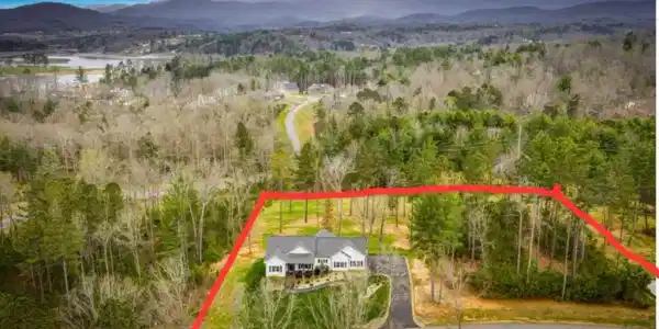 Image 3: Photo shows the included additional 1-acre lot.