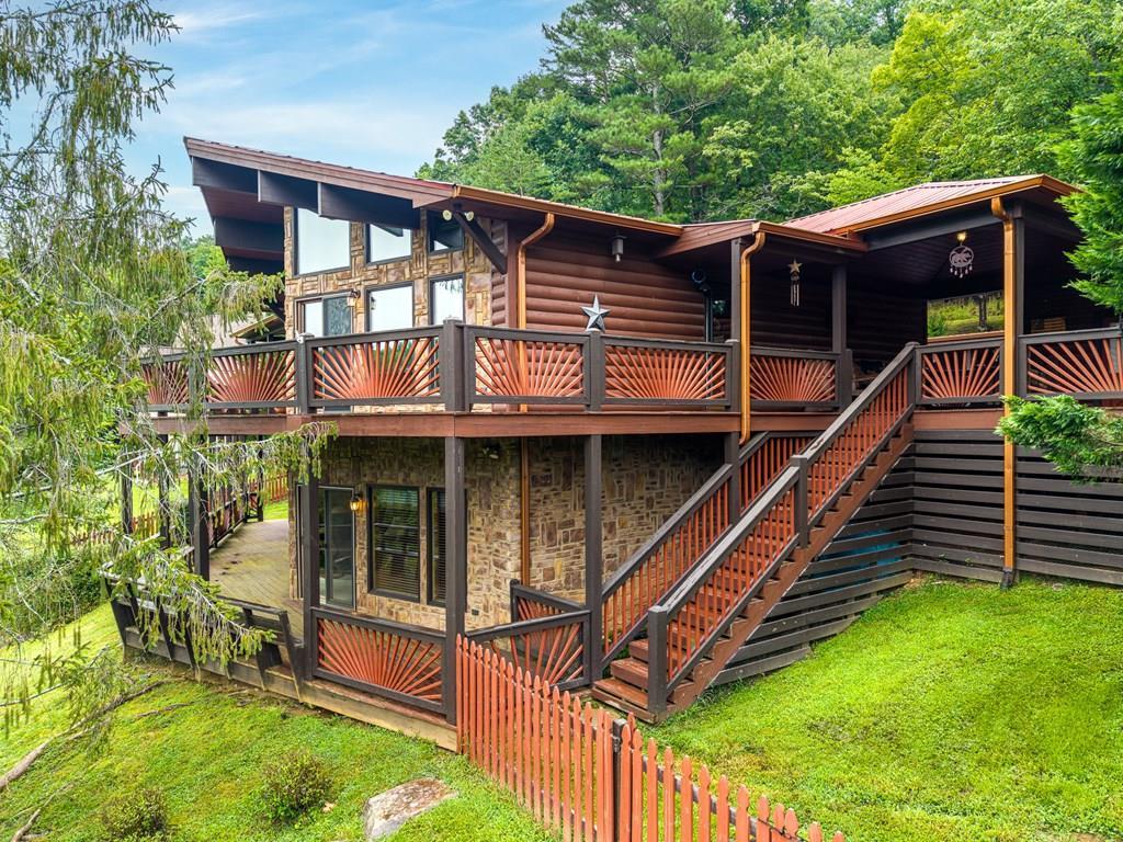 Image 2: 2 levels of decks to entertain family and friends and looks over Talona Lake!