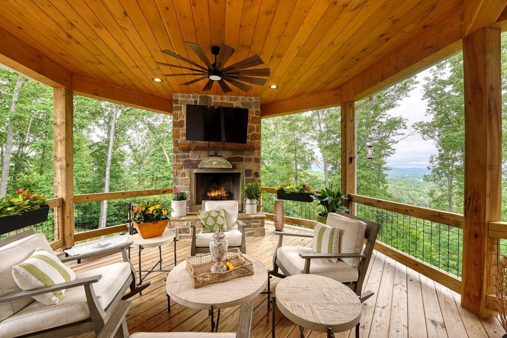 Image 3: Outdoor Fireplace and Entertaining Area, Conveniently angled toward the view for optimal enjoyment.