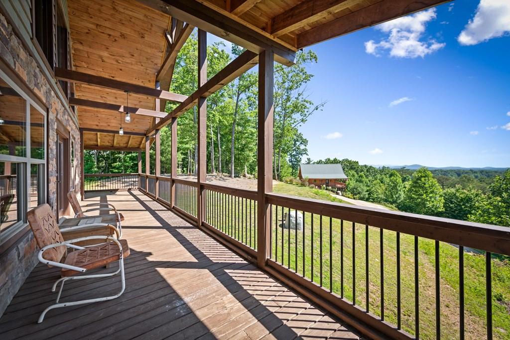 Image 2: Covered porch allows you to enjoy the views in every season