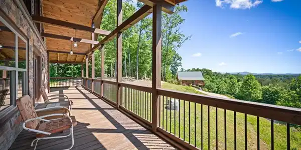 Image 2: Wrap-Around covered porch allows you to enjoy the views in every season