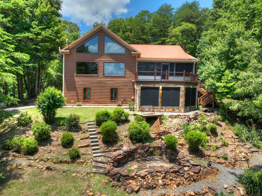 Image 3: Back of the home and landscaping
