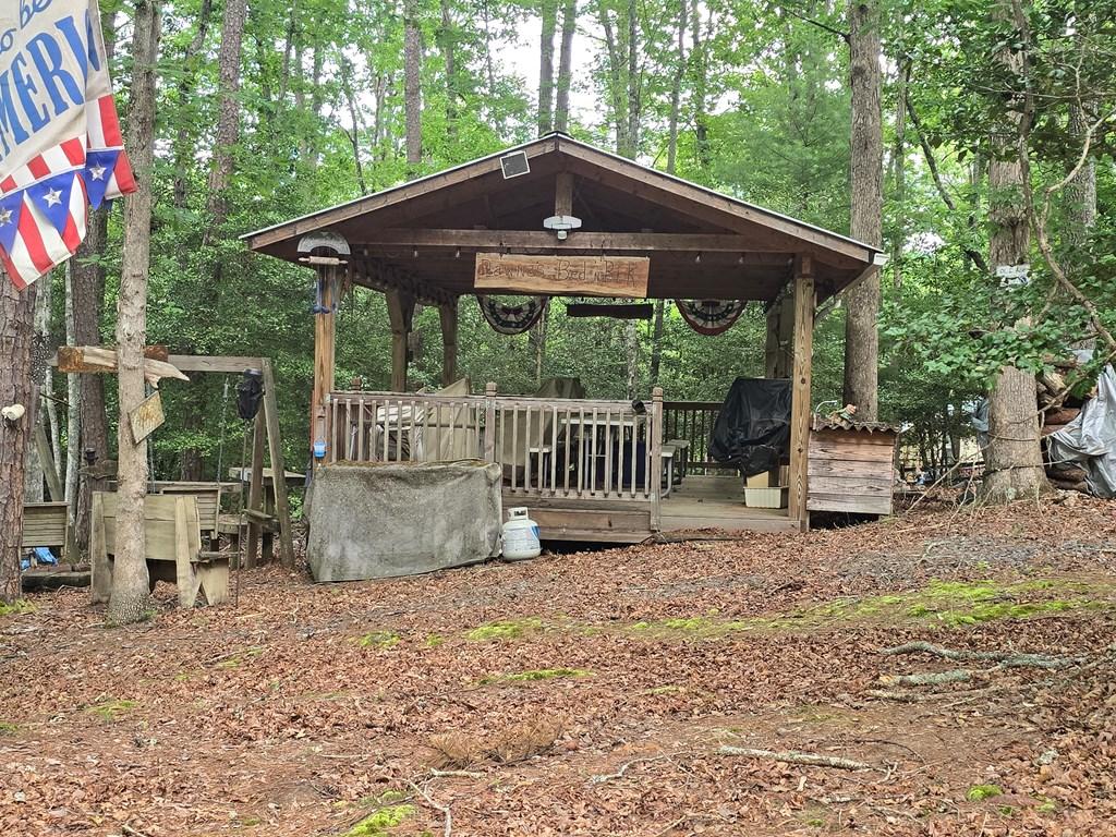 Image 3: Extra Large Pavilion with Tables and Rockers, Constructed with a metal roof approximately April 2017