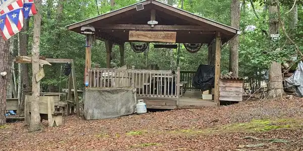 Image 3: Extra Large Pavilion with Tables and Rockers, Constructed with a metal roof approximately April 2017