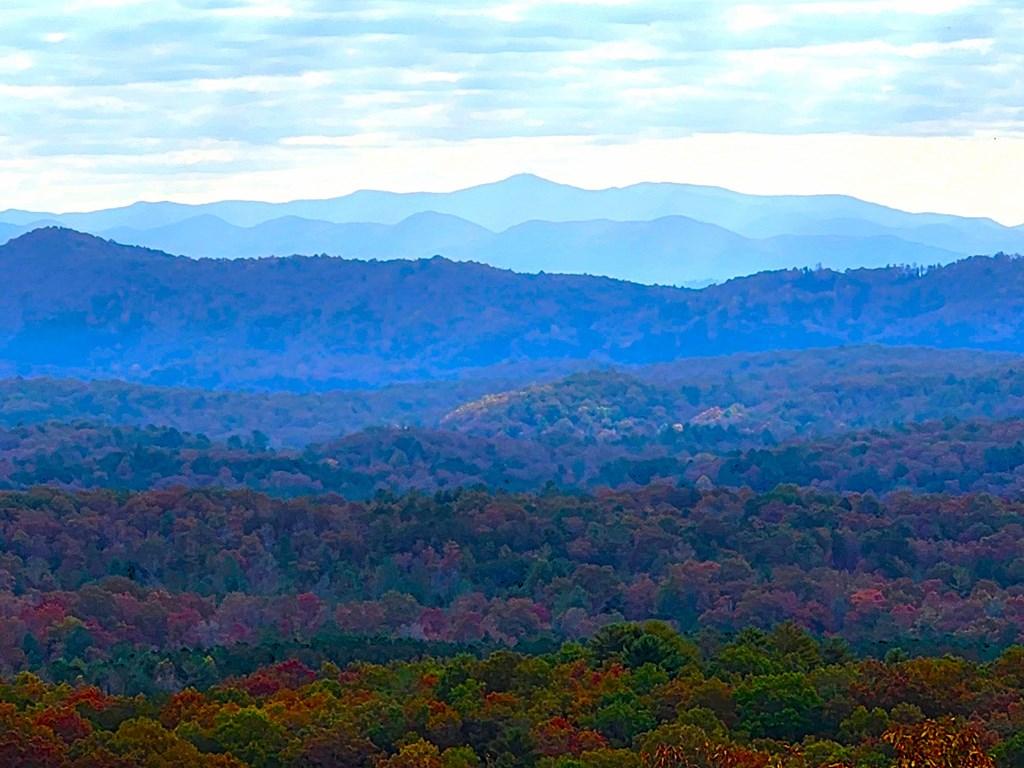 Image 2: LONG-RANGE MOUNTAIN VIEWS, VISIBLE FROM BALCONY AND MASTER BED, KITCHEN, LIVING / DININGROOM.