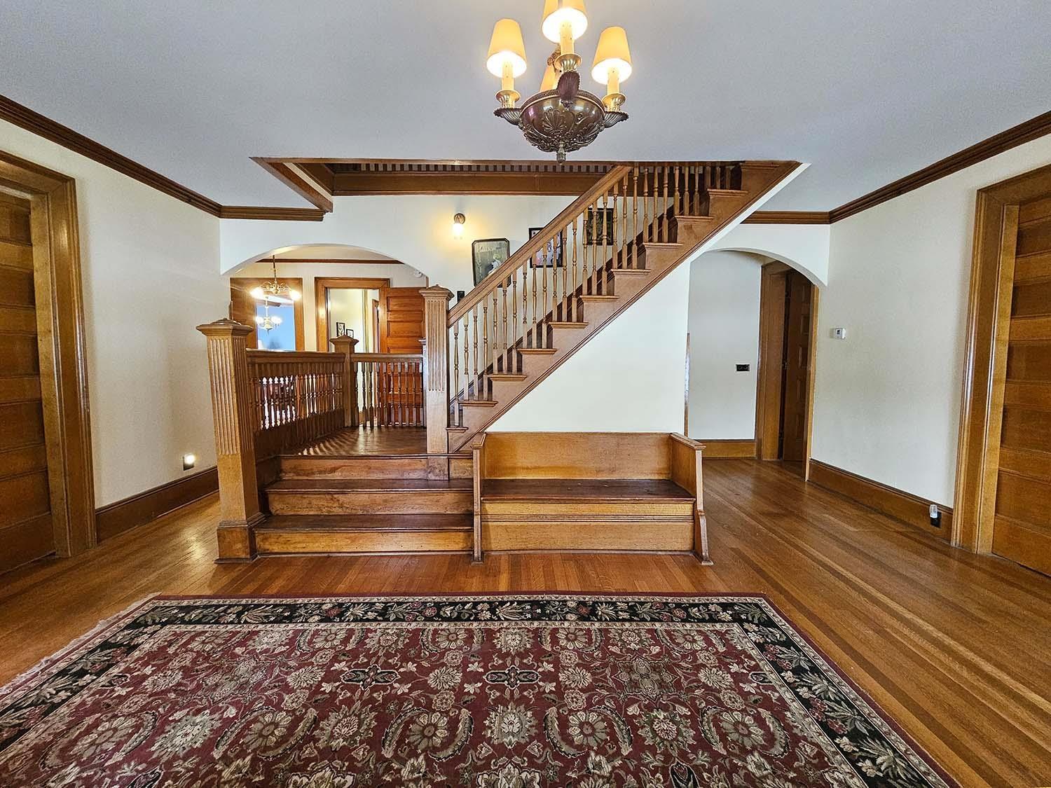 Image 2: 1st Floor Entryway With Grand Staircase