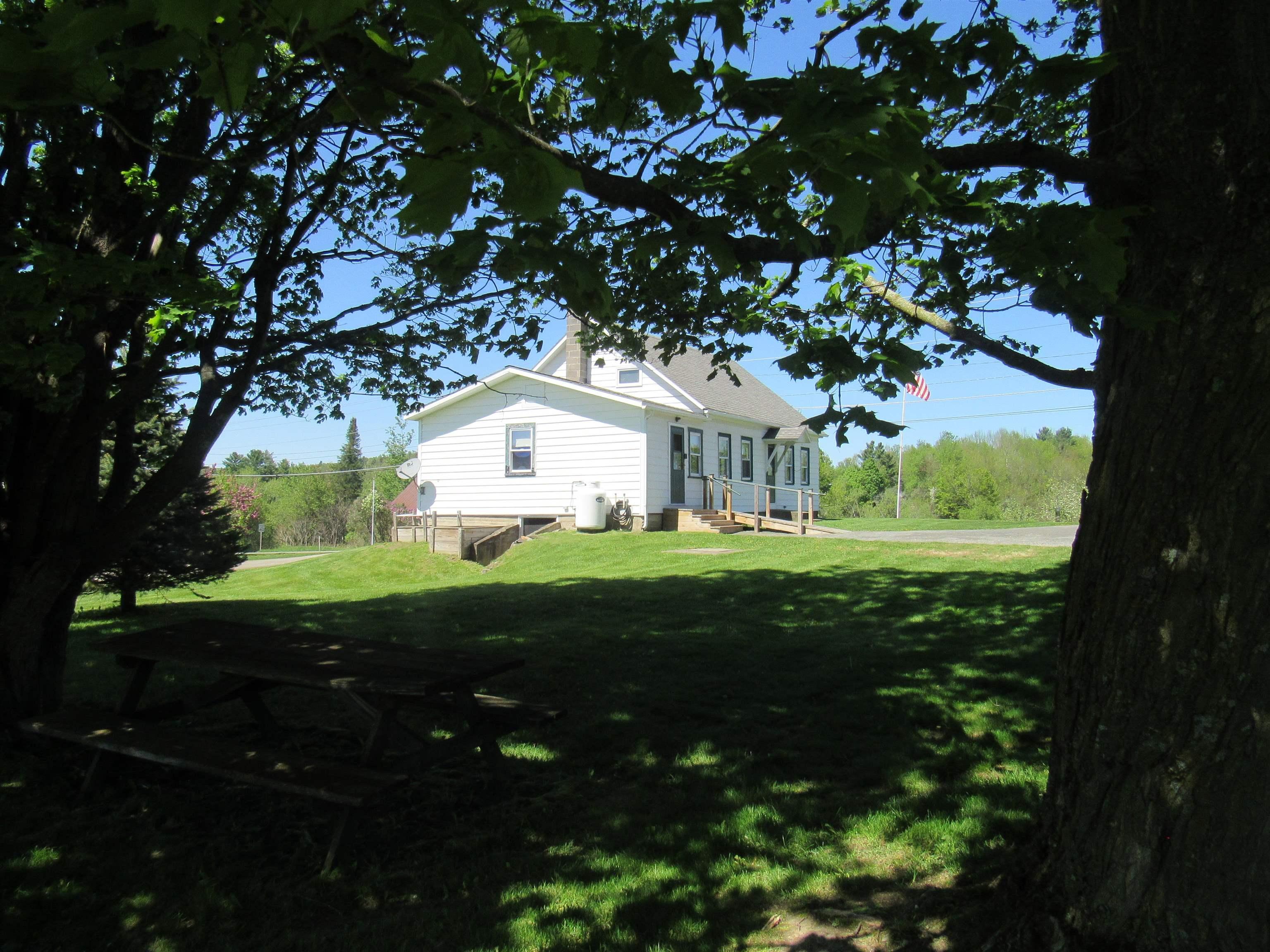 Image 1: From Mature Shade Trees Looking Back at the House