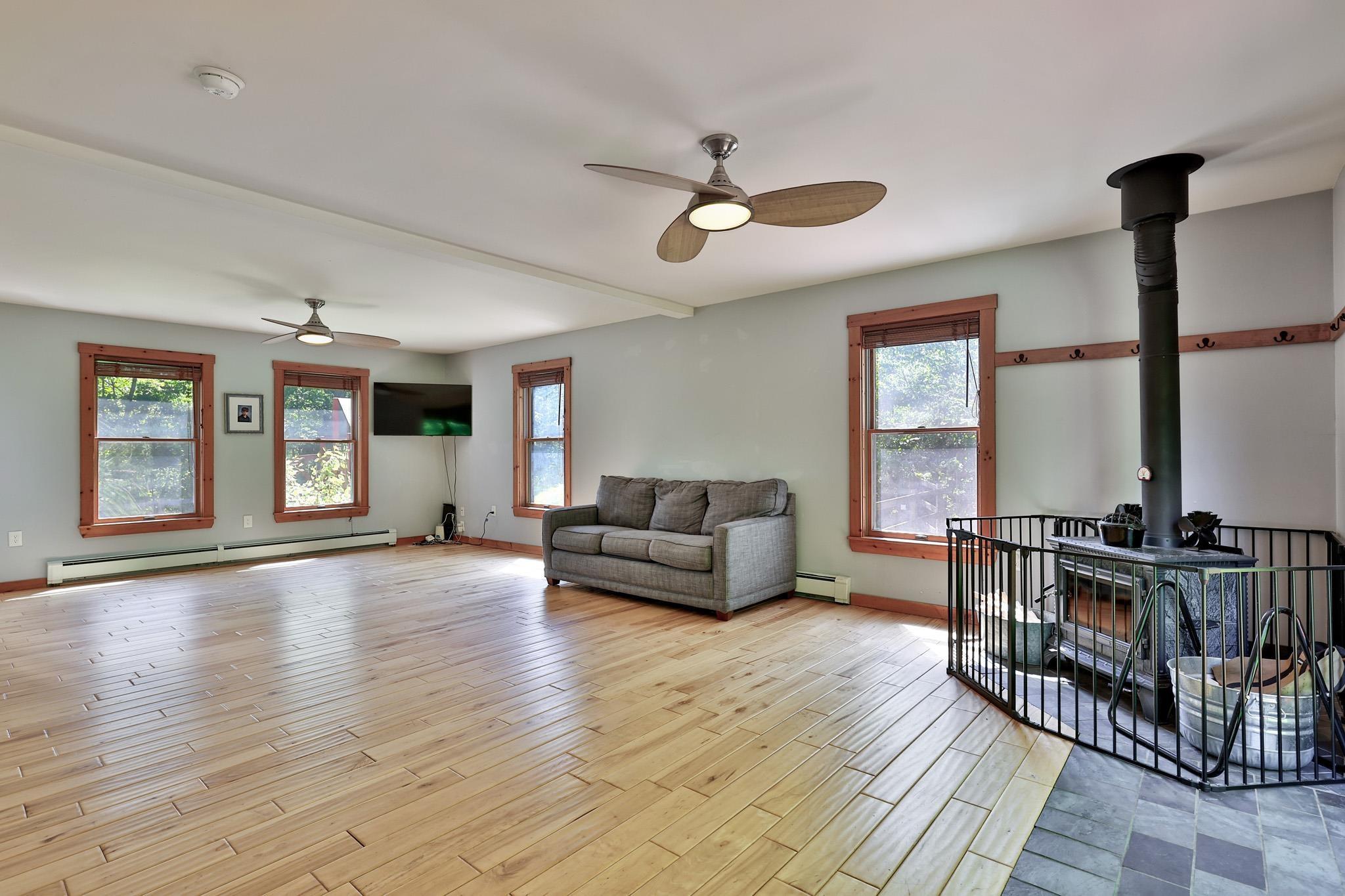 Image 4: Generous Living Room with Woodstove