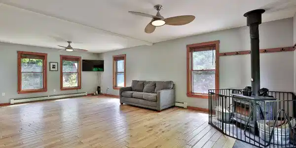 Image 4: Generous Living Room with Woodstove