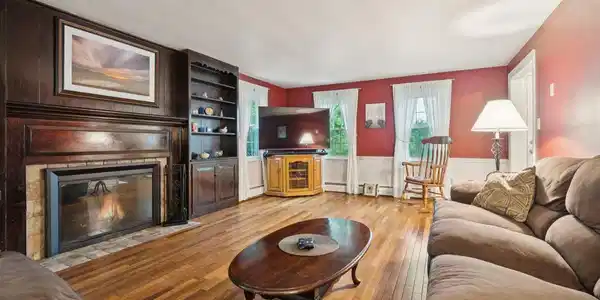 Image 4: Living room with wood-burning fireplace
