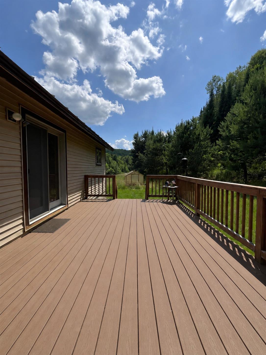 Image 4: Large composite deck = low maintenance Image 4: Large composite deck = low maintenance