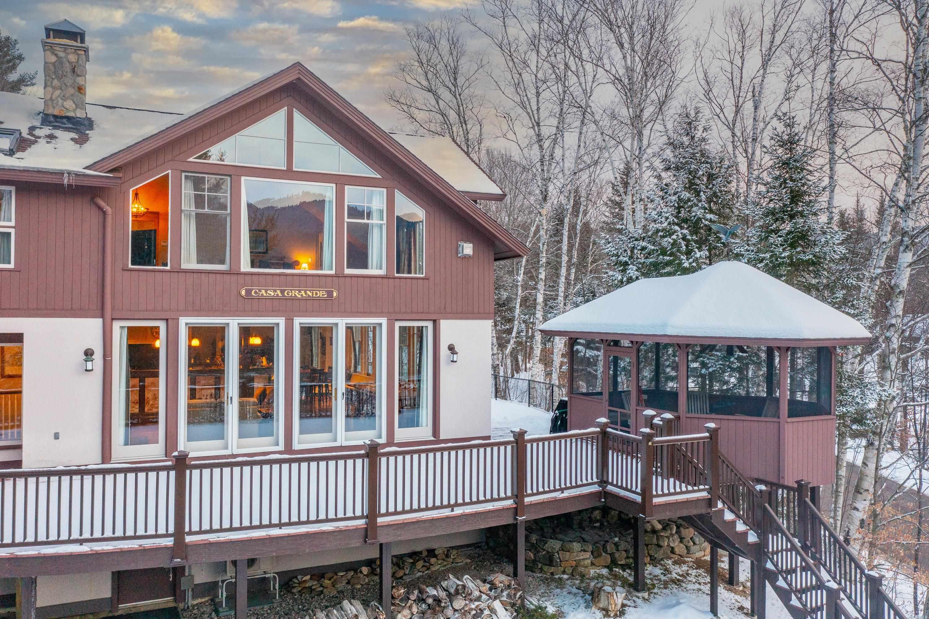 Image 4: Extensive deck with screened gazebo