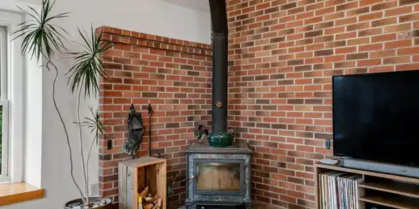 Image 3: Living room w/ soapstone stove
