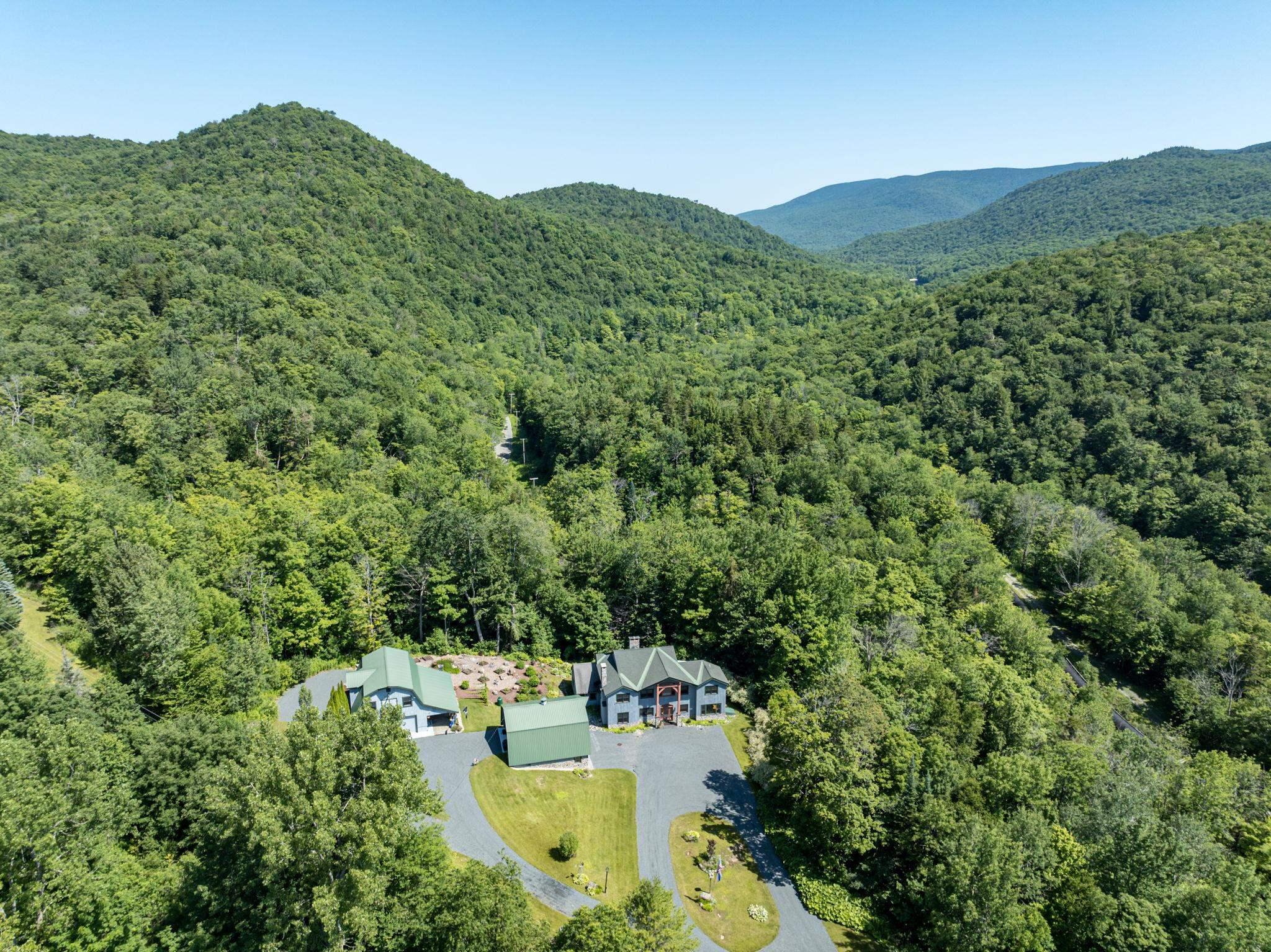 Image 1: Mountain setting, multiple buildings, lawn, gardens, privacy