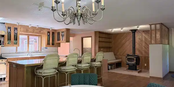 Image 3: Large country kitchen with breakfast area and woodstove