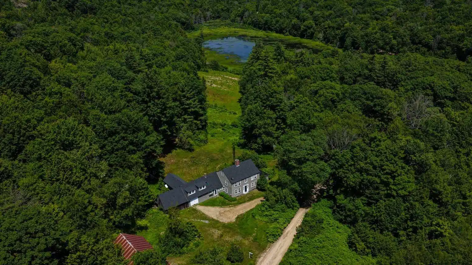 Image 1: View of house with pond