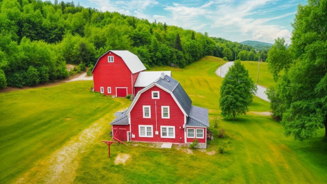 Image 0: The mowed acreage is expansive., Behind the barn