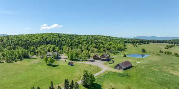 Image 2: Aerial view of Estate & Mountains