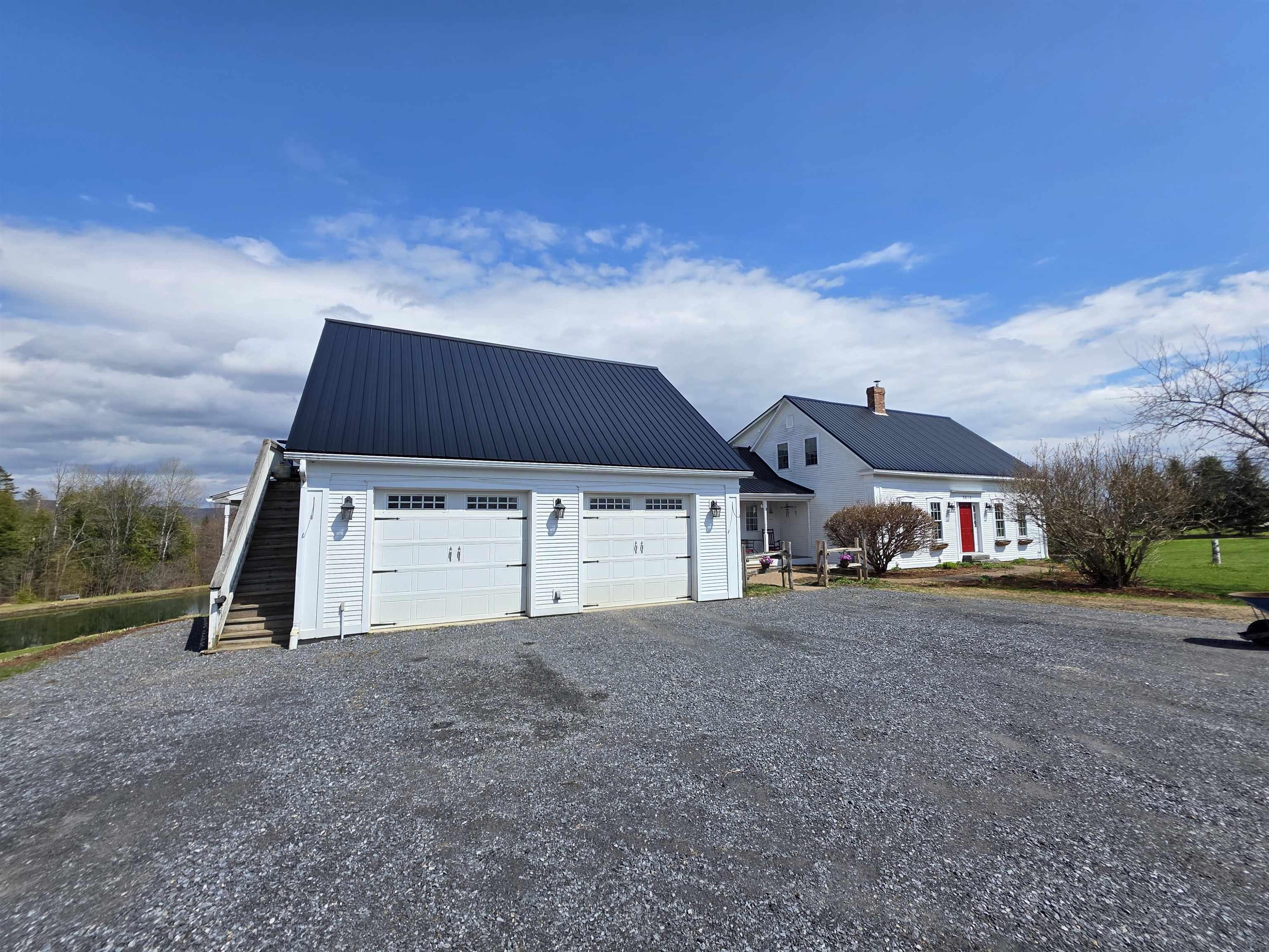 Image 3: Two car attached garage with apartment overhead