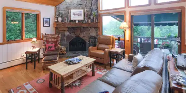 Image 2: Living room with wood burning fireplace