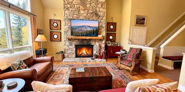 Image 4: Floor to ceiling fieldstone fireplace