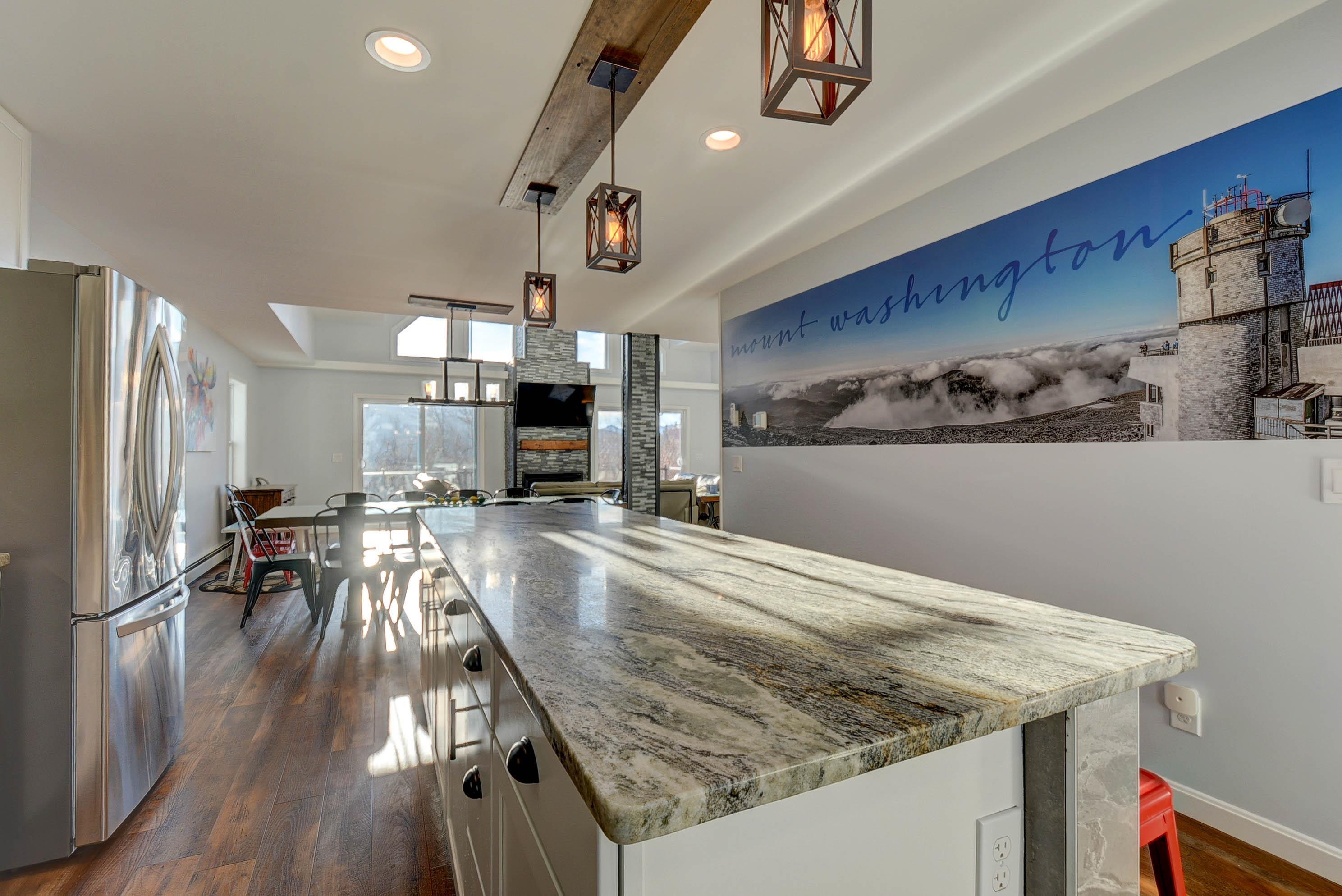 Image 3: Granite counters and stainless-steel appliances.