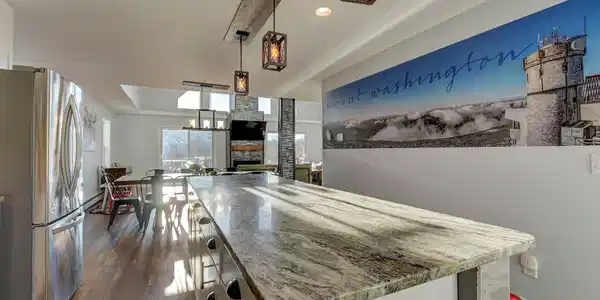 Image 3: Granite counters and stainless-steel appliances.