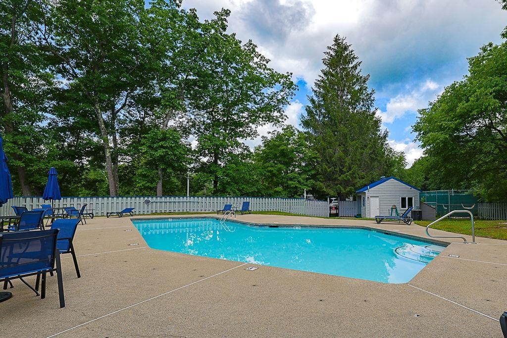 Image 3: outdoor pool, with plenty of patio seating and lounge chairs Image 3: outdoor pool, with plenty of patio seating and lounge chairs