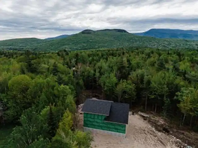 Image 1: Drone shot of property with mountain views!