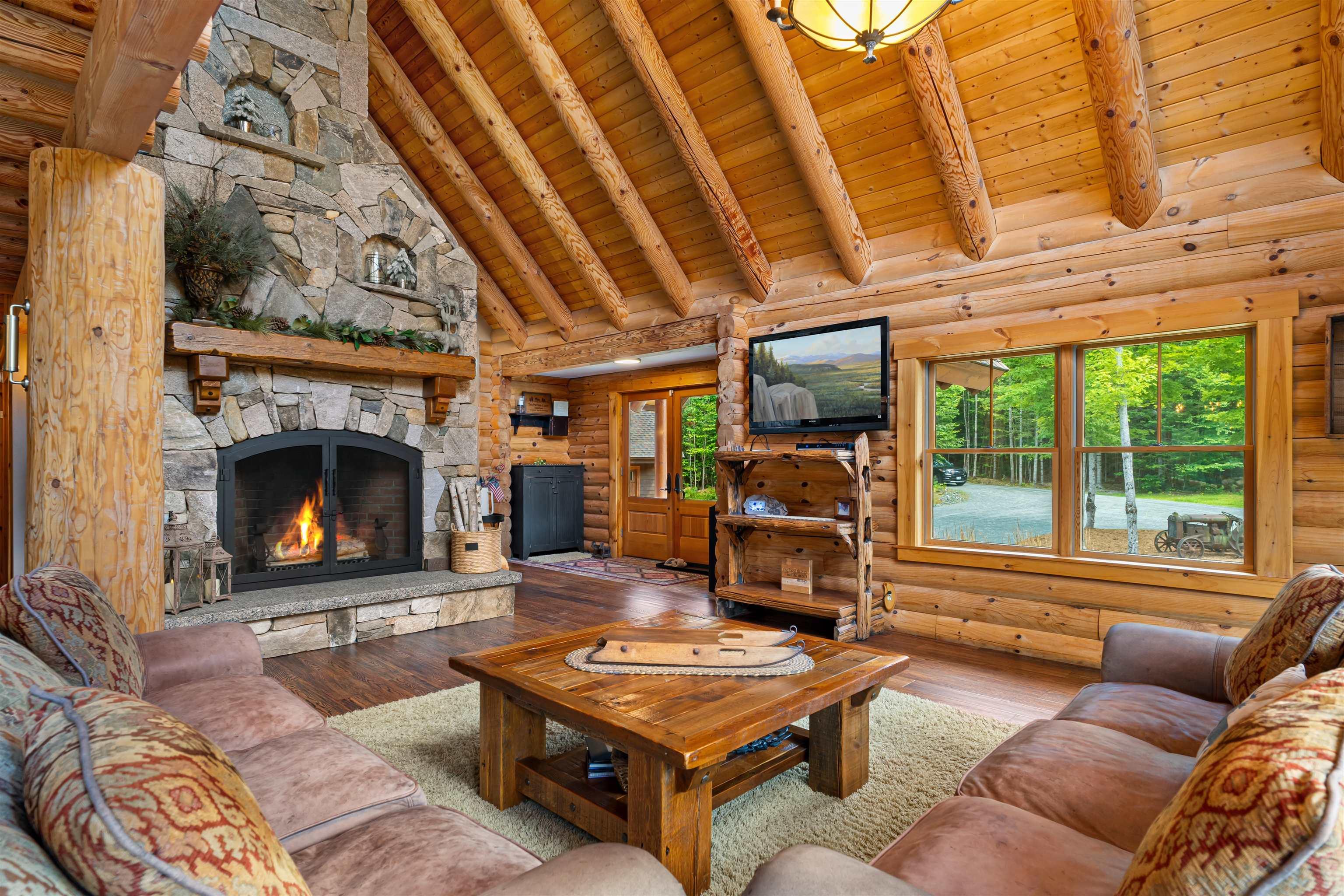 Image 2: Wood-Burning Fireplace with Floor-to-Ceiling Stone Hearth