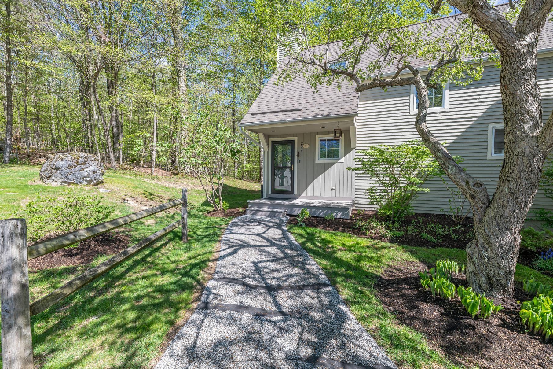 Image 4: paved walkway to front door