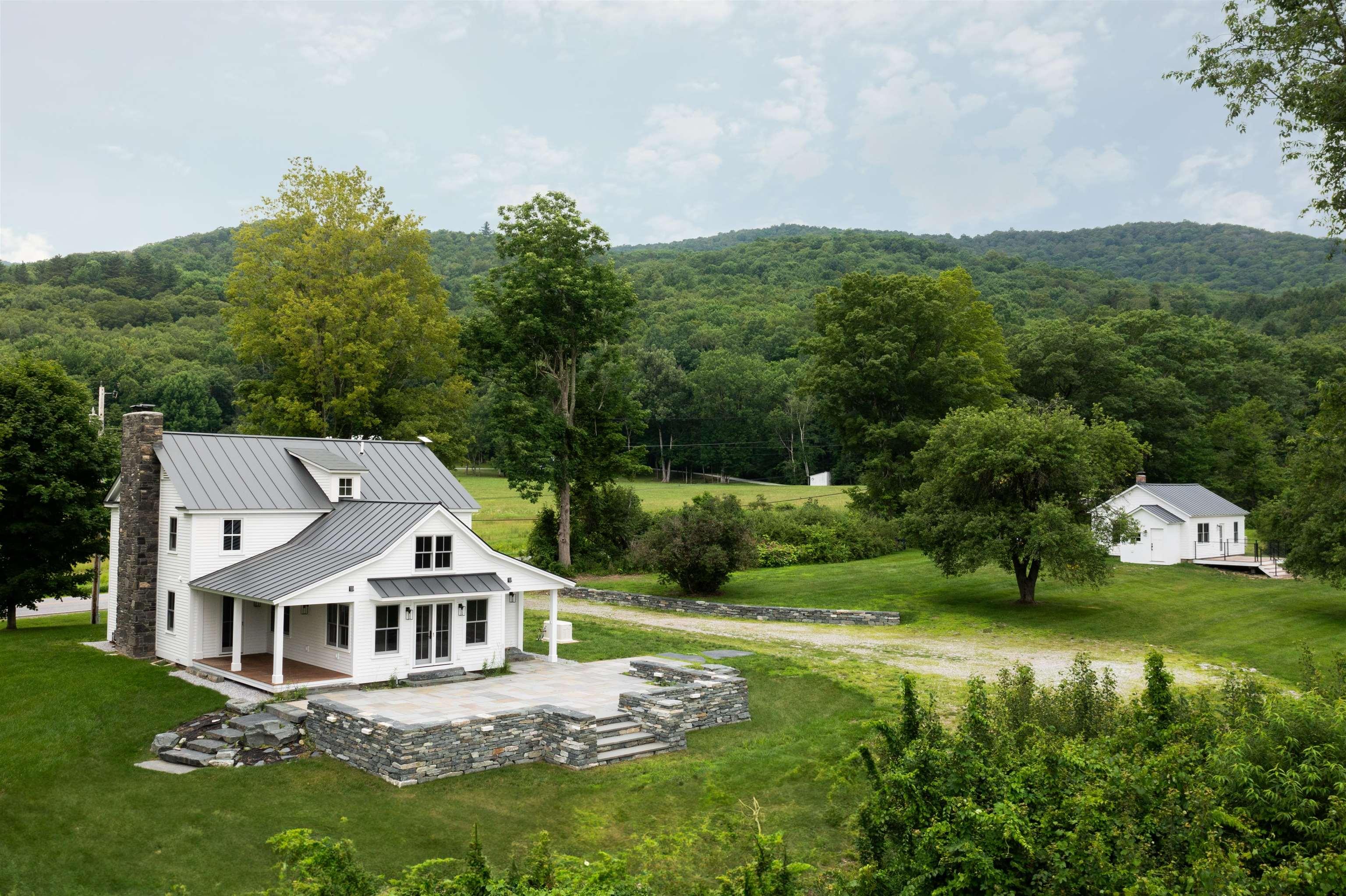 Image 0: Rear view of house and cottage