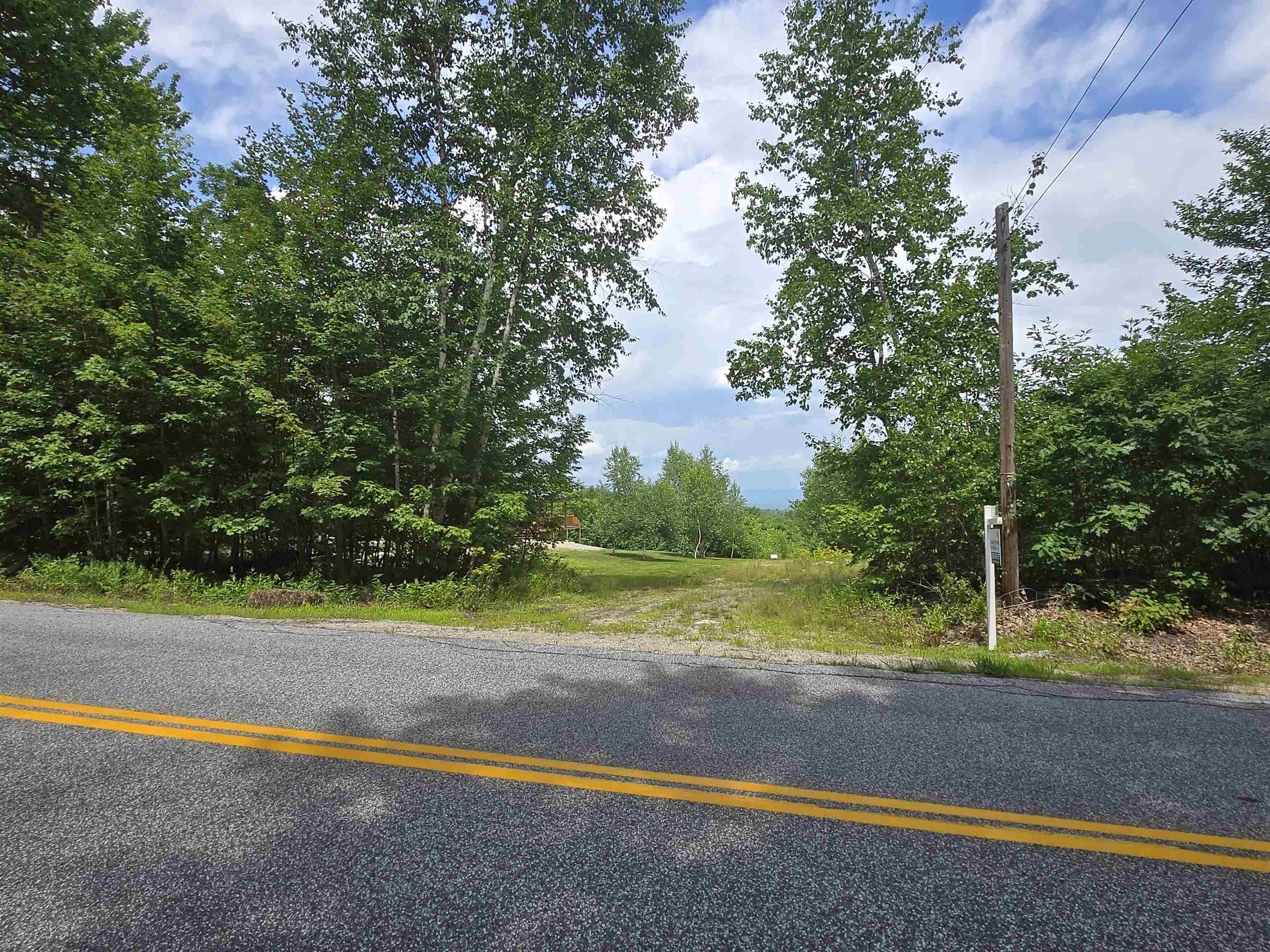 Image 4: View from street looking down driveway