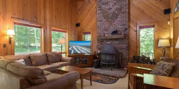 Image 4: Large living area centered by a woodstove